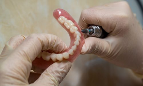 dental technician making dentures